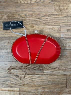 Red Hardcase Oval Clutch with Gold Chain